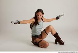 Woman Adult Average Fighting with gun Kneeling poses Casual Latino